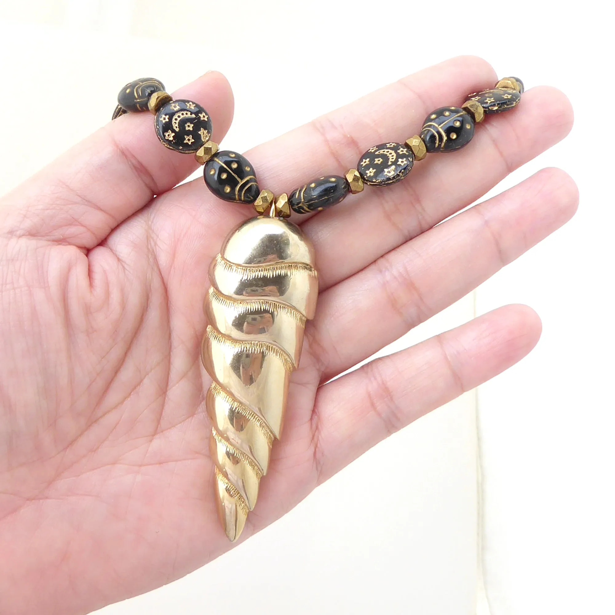 Golden spearhead necklace