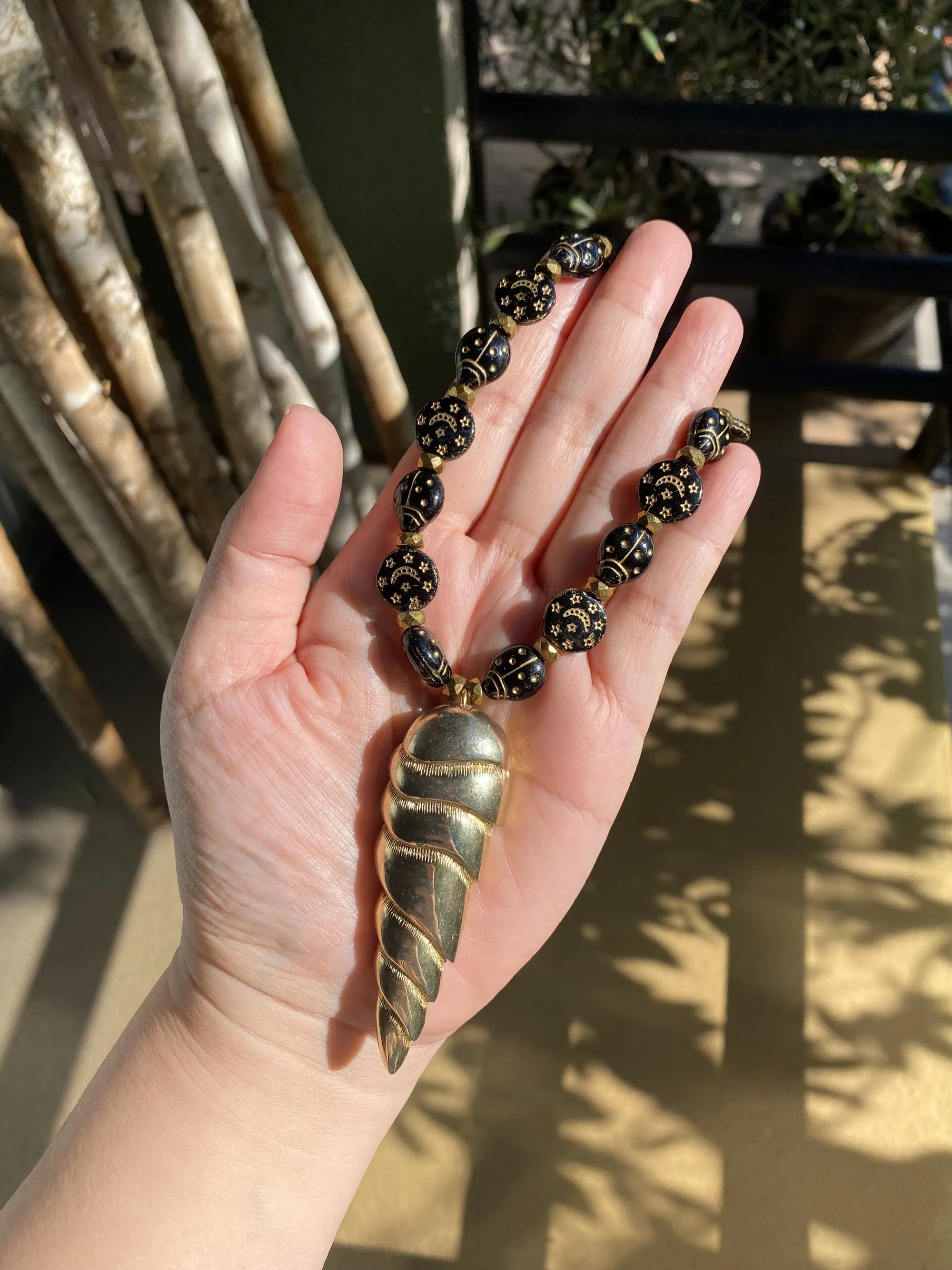 Golden spearhead necklace